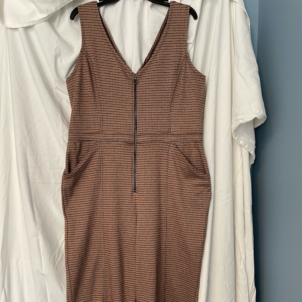 Sleeveless Juniors-fit plaid jumpsuit with front zipper.